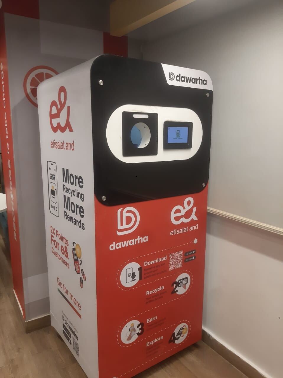 An e& co-branded Dawarha machine indoors